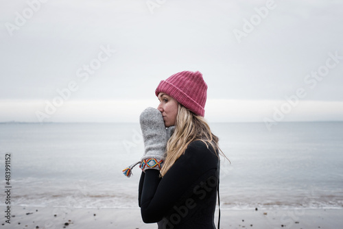 woman getting ready breathing for cold water swimming in the ocean photo