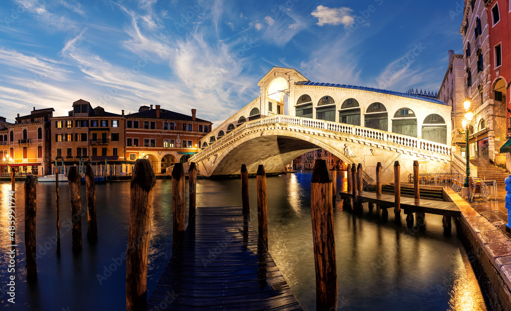 Rialto Bridge in twilight, famous landmark of Venice, Italy