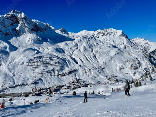 Panoramic view of pistes, ski slopes and mountains of noble skiing resort Zuers, part of the Arlberg ski area. Vorarlberg, Austria. photo