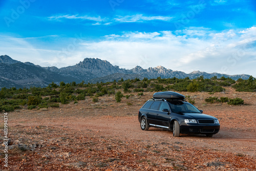 Tourist car on the background of the mountains of the canyon and the desert. Croatia. © Denis Rozhnovsky