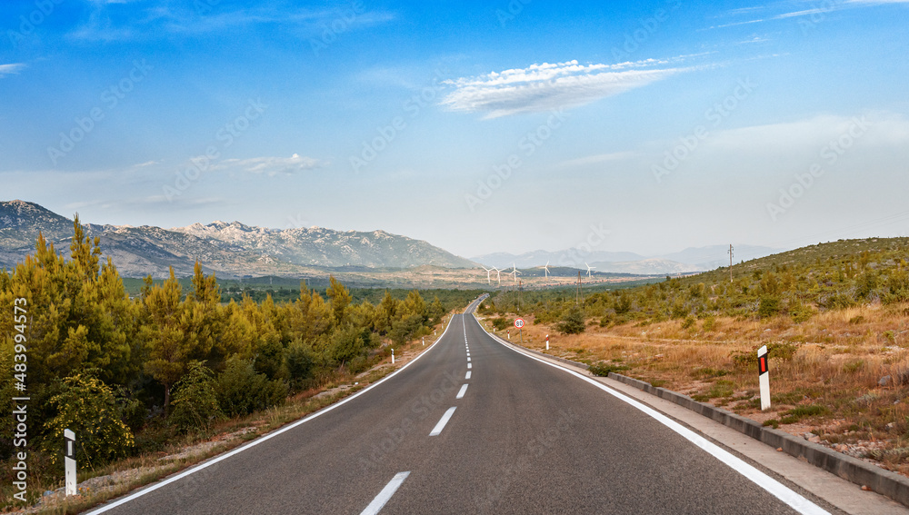 Fototapeta premium Scenic road. The road is surrounded by a magnificent natural landscape.