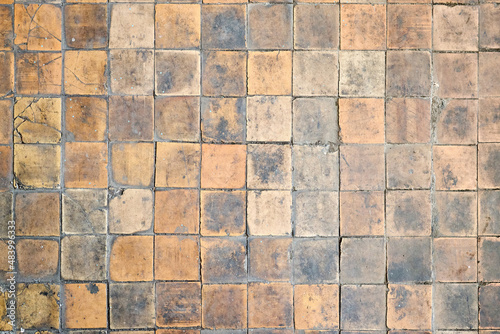 Wallpaper Mural Orange brown white beige old shabby worn out floor tiles with damages cracks dirt caverns potholes and paint stains. Art retro grunge design background texture. Torontodigital.ca
