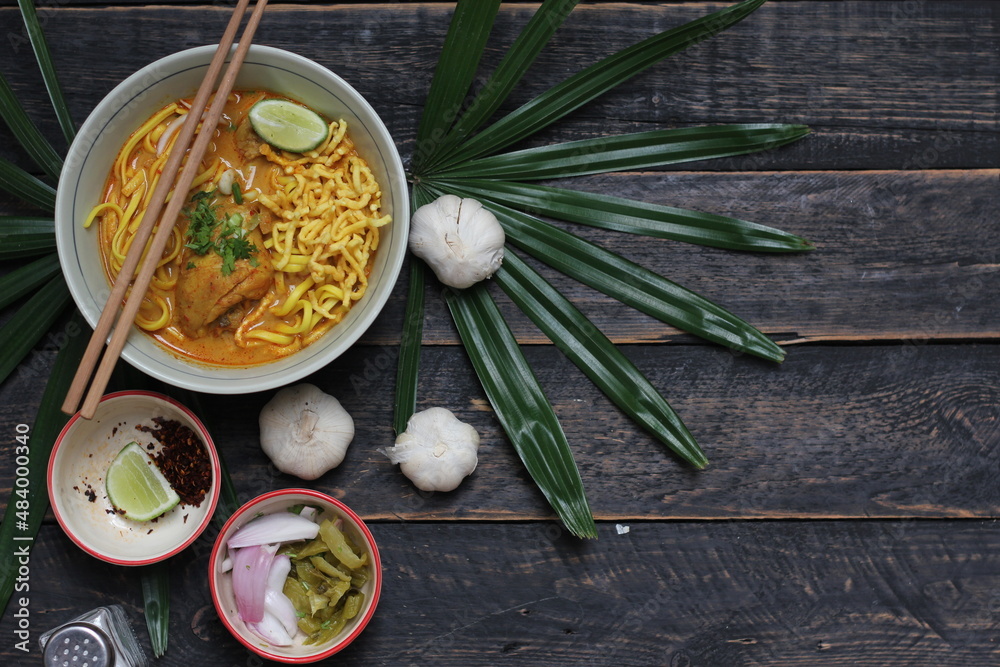 Khao Soi Recipe,Khao Soi,Khao Soi Kai, Thai Noodles Khao Soi, Chicken Curry with seasoning served on wooden table