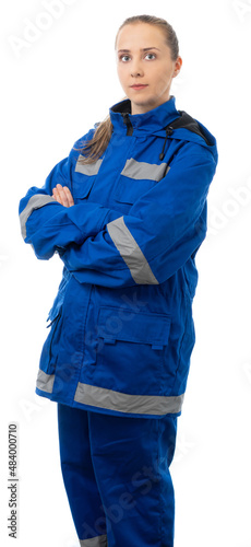 Paramedic, doctor, nurse folded her arms over her chest and looking at the camera. woman in a blue suit for the medic. isolated