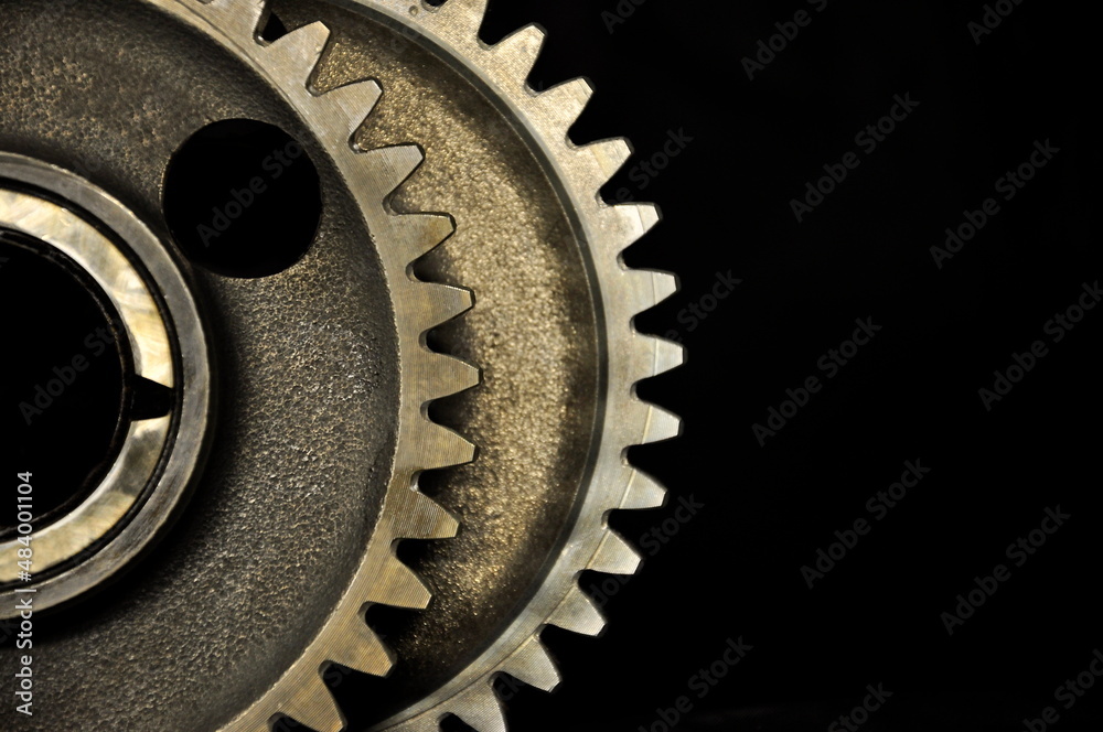Metal cogwheels on a black background. Metal cogwheels on a black background.