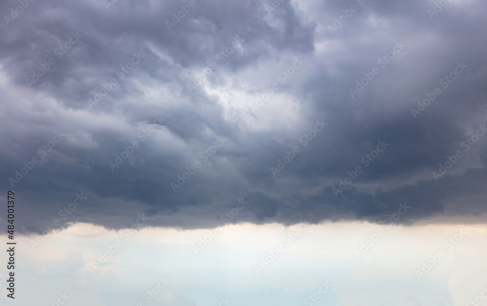 Cloud on blue sky background. White and grey color cloudscape, gloomy weather