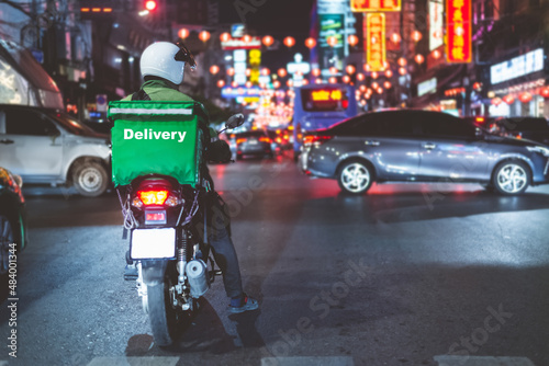Food delivery drivers are driving to deliver products to customers who order online. Impact of epidemics photo