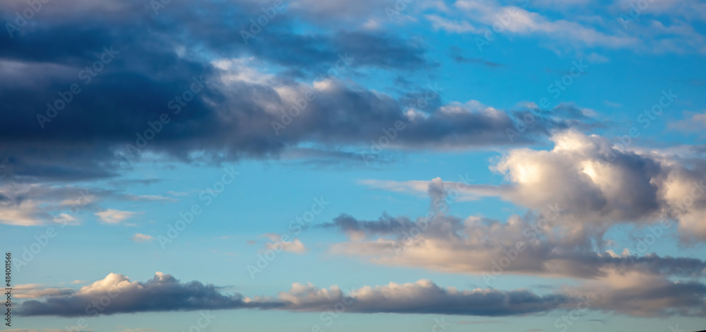 Twilight light color the cloudy sky. Cloud on blue sky background. Cloudscape grey and orange shade.