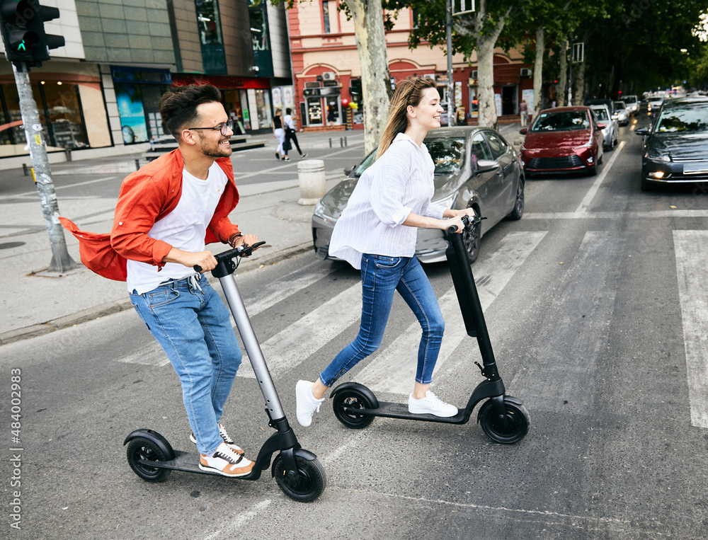 couple young electric scooter city transport riding technology lifestylestreet friend driving modern couple young electric scooter city transport riding technology lifestylestreet friend driving modern