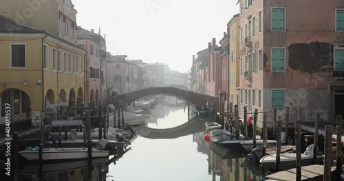 Chioggia town in venetian lagoon, water canal. Chioggia is a seaside town south of Venice, Italy. Traversed by the Corso del Popolo thoroughfare, its historic area has canals and narrow alleys.