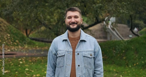 Thankful man keeping hand on his chest expressing gratitude photo