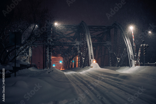 night photo of a snow-covered bridge during a blizzard (ID: 484008500)