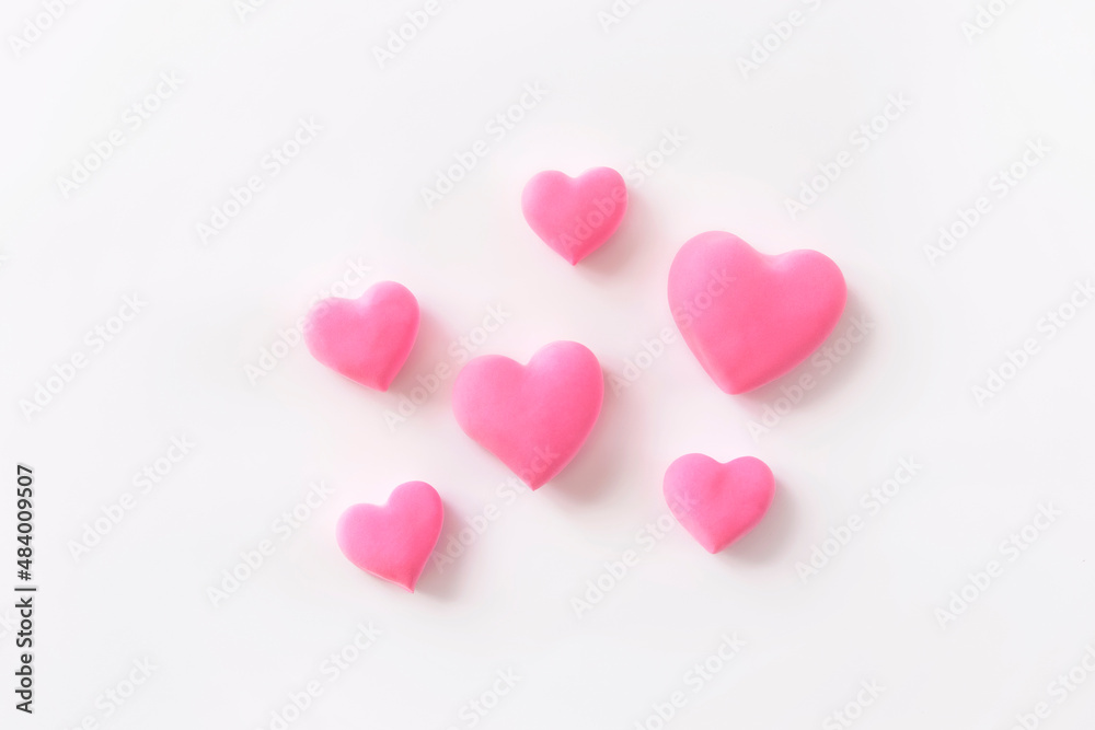 3d pink hearts creative arrangement on white background. Concept of love, romantic relationship, heart shape symbol, simple layout, celebration of Valentine's Day, wedding background. 3d pink hearts creative arrangement on white background. Concept of love, romantic relationship, heart shape symbol, simple layout, celebration of Valentine's Day, wedding background.