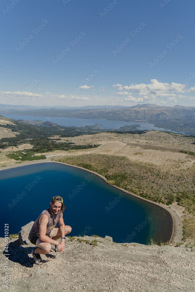 person sitting on a cliff