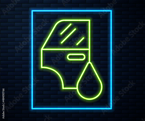 Glowing neon line Car painting icon isolated on brick wall background. Car body repair process. Vector