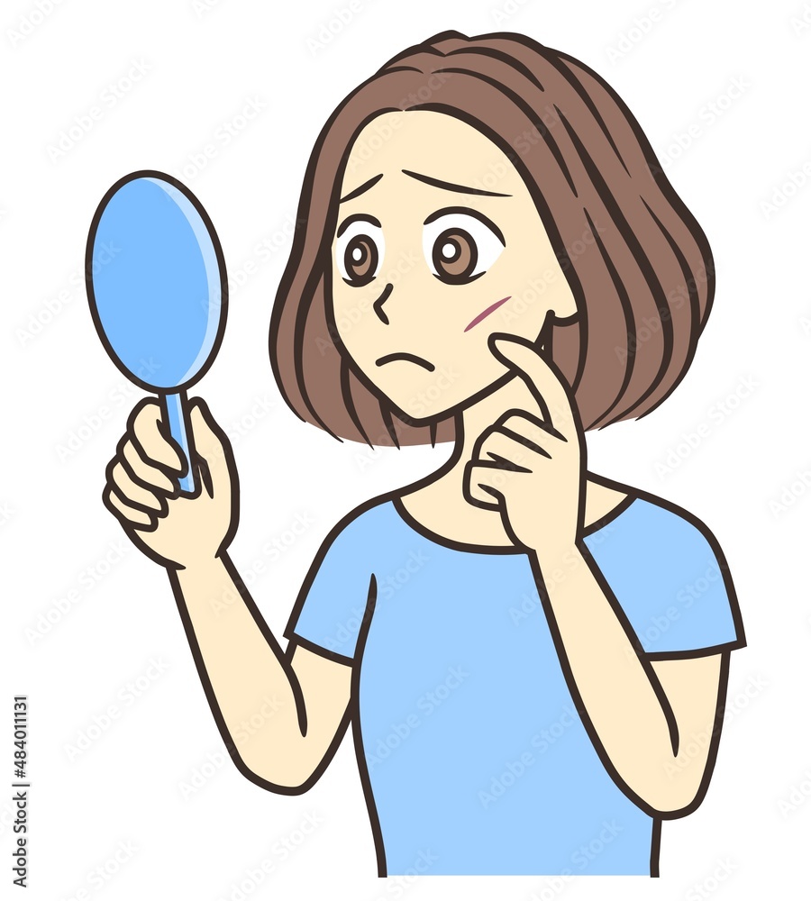 A young woman looking at a scar on her cheek in a hand mirror A young woman looking at a scar on her cheek in a hand mirror