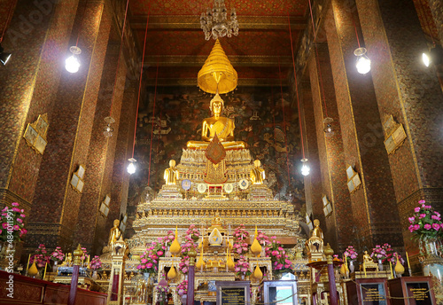 Phra Buddha Deva Patimakorn, Gorgeous Buddha Image Sitting on the Three-tiered Pedestal with Amazing Mural in Backdrop, Ordination Hall of Wat Pho Temple, Bangkok, Thailand