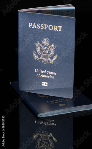 US Passports on dark background with reflection