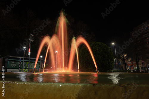 Italy, January 2022: long exposure of colored fountain in the center of Pesaro