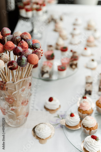 the wedding candy bar is filled with different desserts. wedding table at the banquet