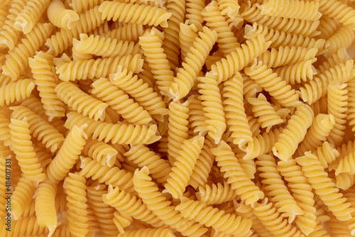 Variety of types and shapes of dry Italian pasta. Background.