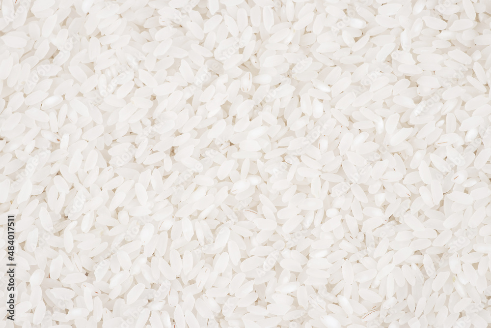 White long rice background, uncooked raw cereals, macro closeup White long rice background, uncooked raw cereals, macro closeup