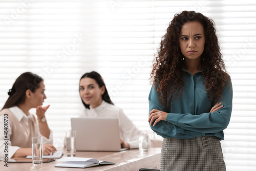 African American woman suffering from racial discrimination at work photo