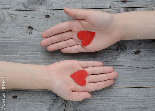 Valentine's day , 14 february .Declaration of love . valentine , two hearts . Valentines in the shape of a heart in hand .