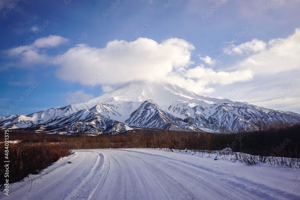 Fototapeta premium Snow covered Vilyuchinsky volcano in winter