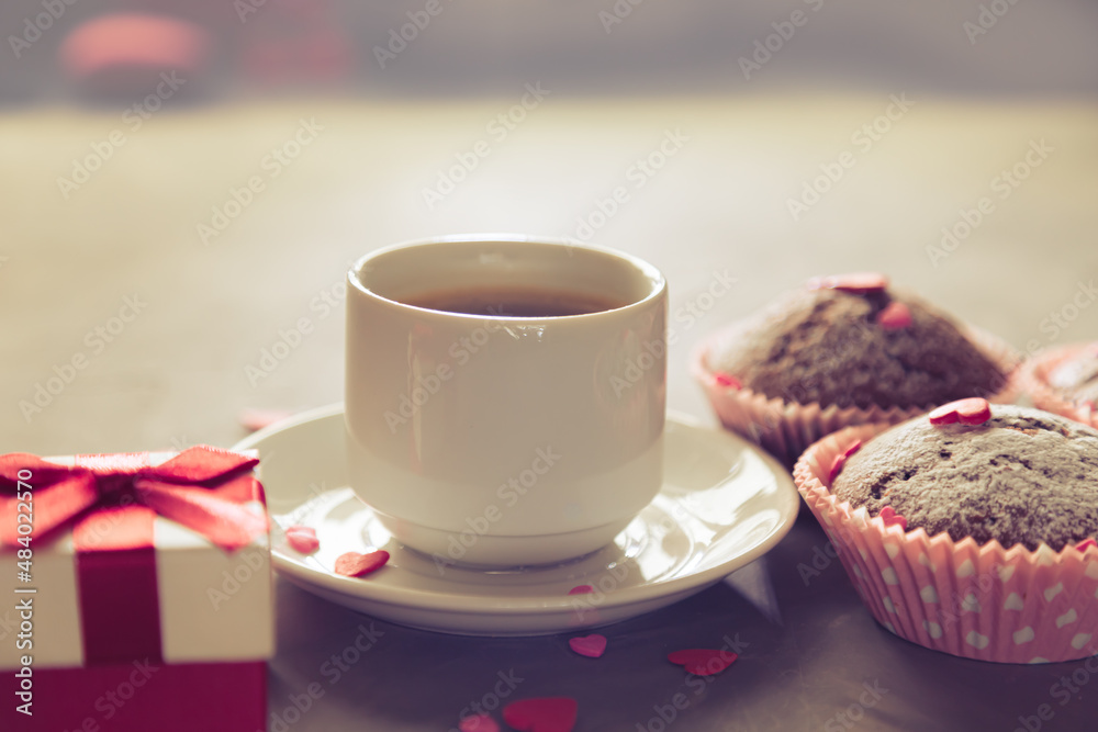 Cup of coffee, chocolate muffins and gift. Cup of coffee, chocolate muffins and gift.