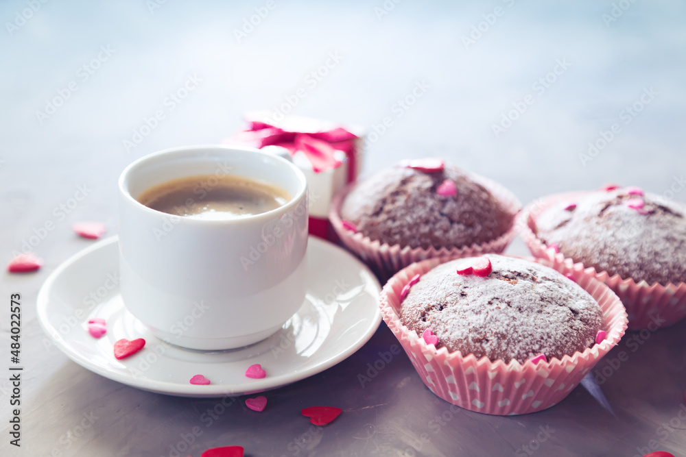 Cup of coffee, chocolate muffins and gift. Cup of coffee, chocolate muffins and gift.