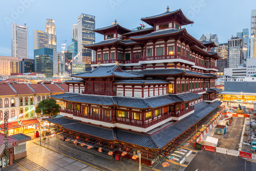 Buddha Toothe Relic Temple in Chinatown in Singapore, with Singapore's business district in the background.
