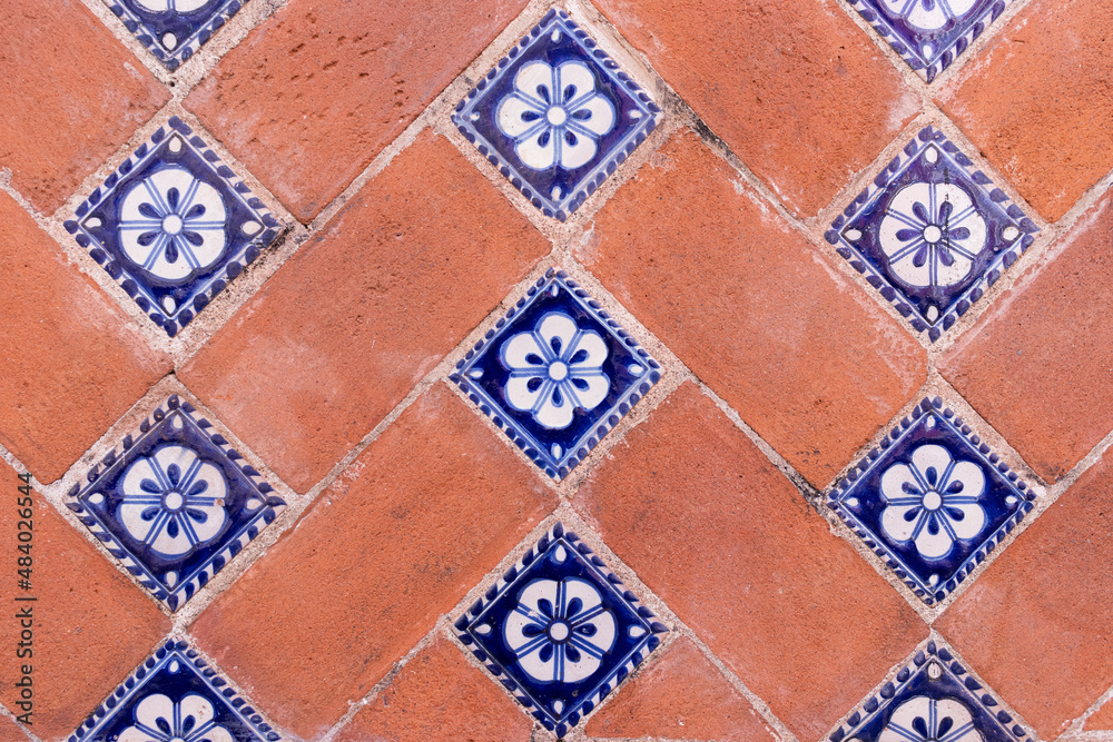 A traditional brick and talavera tiles wall in Puebla city, Mexico