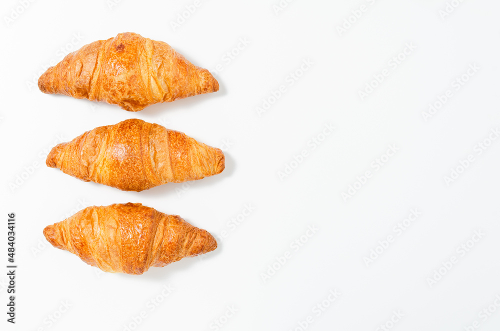 Three fresh croissants isolated on a white background Three fresh croissants isolated on a white background
