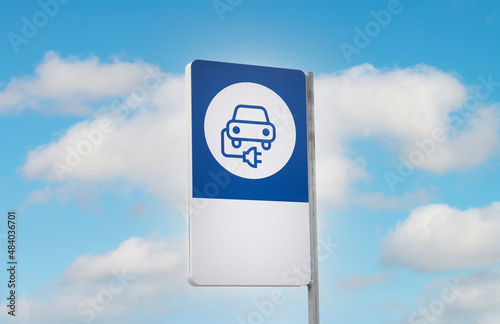Charging station for electric cars. Parking area for electric cars with charging station. Electric cars charging station sign, in a cloudy day.