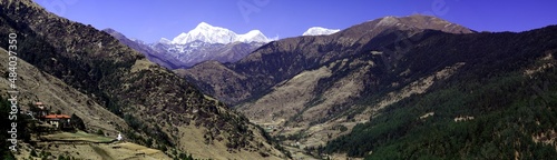 Panorama of mountains and snow in the Himalayas trekking along Everest Circuit in Nepal.