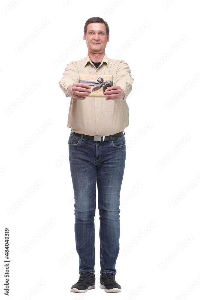 Portrait of an attractive casual man giving present box and looking at camera Portrait of an attractive casual man giving present box and looking at camera