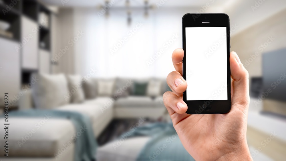 Human using smartphone, controlling smart home systems in modern apartment, blank screen Human using smartphone, controlling smart home systems in modern apartment, blank screen