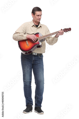 Handsome young man playing guitar on white background
