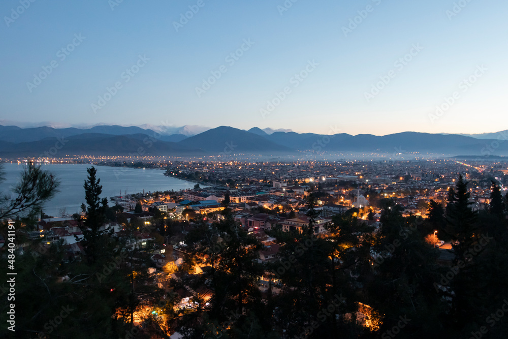 Panorama of Fethiye city. Aerial view of the popular tourist city of Fethiye and the Bay of the Mediterranean sea. Beautiful view of Fethiye city and citylights. 