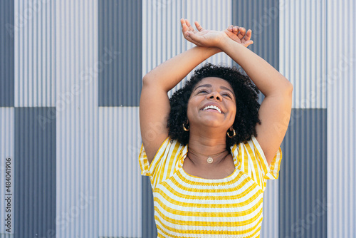 Excited ethnic woman looking at camera photo