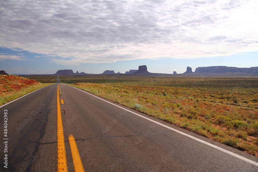 The infinite straight long old road to the Monument Valley The infinite straight long old road to the Monument Valley