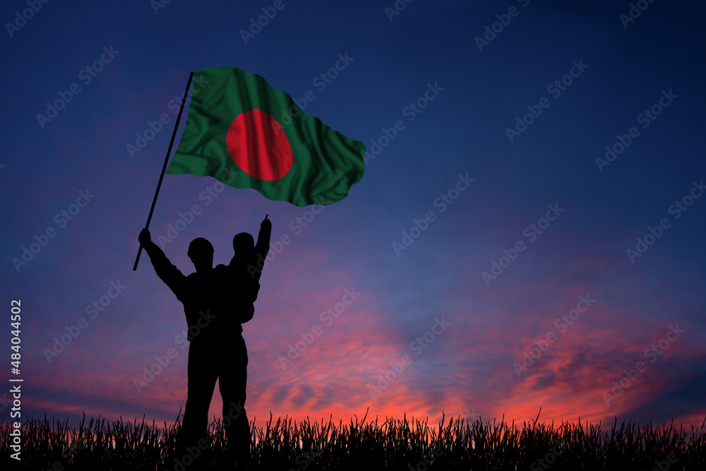 Father and son hold the flag of Bangladesh
