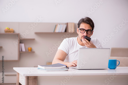 Young male freelancer working from home