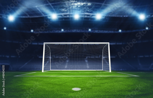 Soccer goalpost under spotlights in the stadium. 3D Rendering © alphaspirit