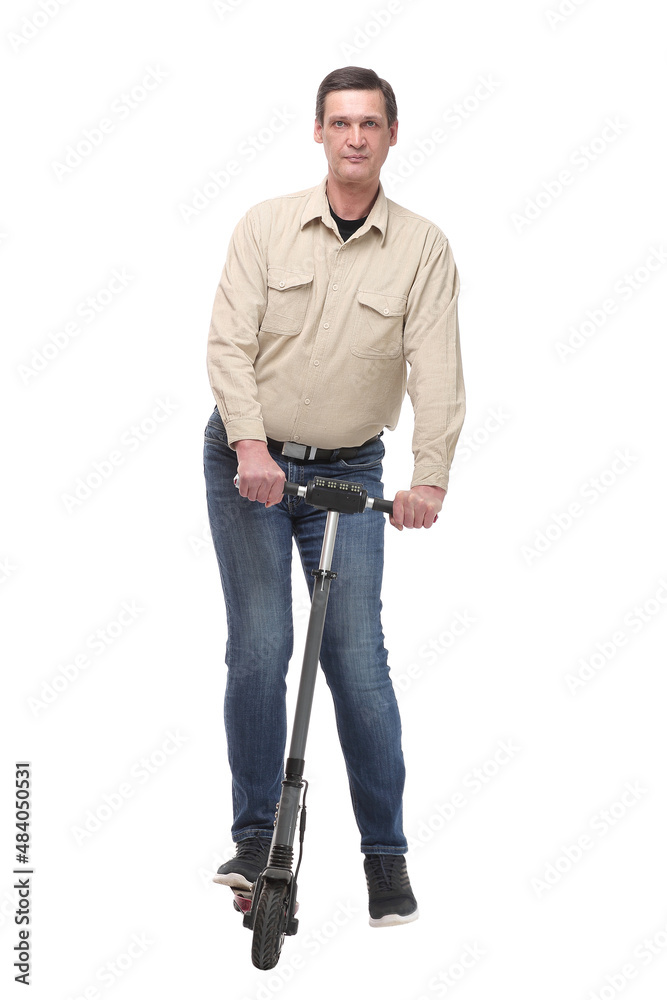 A caucasian businessman riding a scooter to work, can be used for green or gas savings concept A caucasian businessman riding a scooter to work, can be used for green or gas savings concept