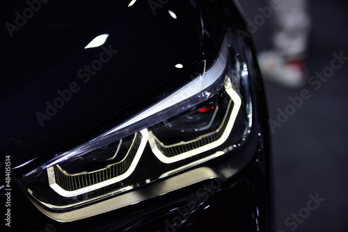 Beautiful parts of the new car. Car headlights, headlights, body lights, modern and sporty look © tharathip