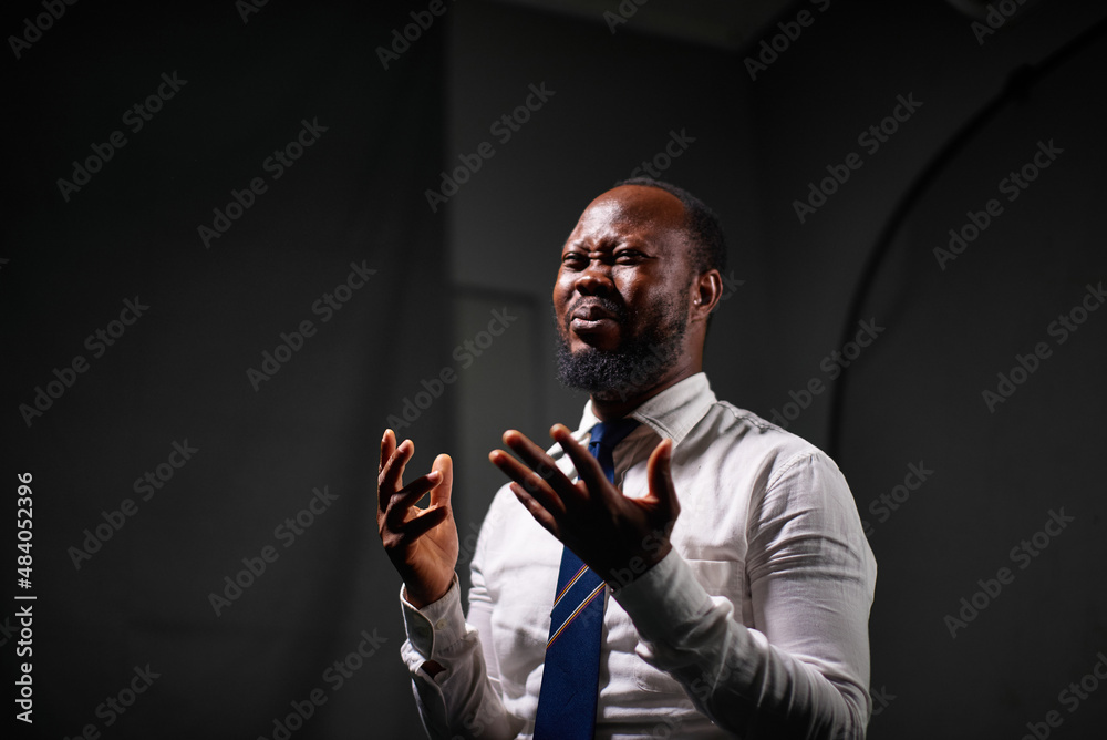 Man speaking with sign language in a studio Man speaking with sign language in a studio