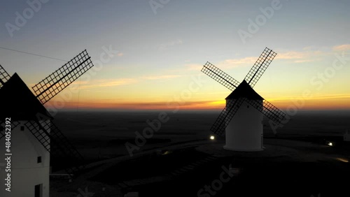 Aerial view of windmills in the countryside in Spain at sunrise