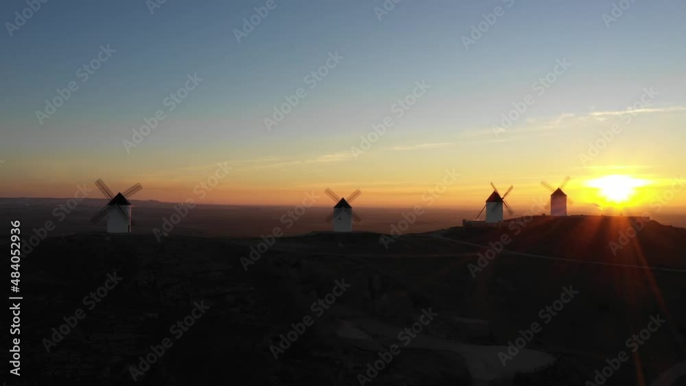 Aerial view of windmills in the countryside in Spain at sunrise Aerial view of windmills in the countryside in Spain at sunrise